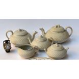 A selection of ceramics, to include three teapots, a cream jug and a small dish,