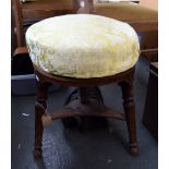 A circular mahogany piano stool with a screw adjusment c.