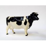 A Beswick black and white bull 12cmH