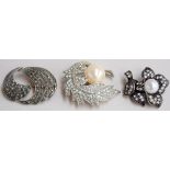 A collection of three brooches,