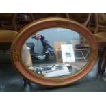 A large oval mirror 66cmD