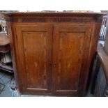 An oak two corner cupboard with two doors and two shelves inside and shell marquetry to the front