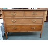 A chest of four drawers, two short over two long,