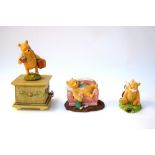 A selection of three Winnie the Pooh figures; 'Pooh sleeping A 0067',