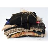 A large bundle of lengths of fabric,to include wool and mohair checks and tweeds,