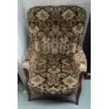 An armchair in brown floral print, 97cmH,