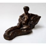 A cold cast bronze statue of a nude reclining African woman 27cmH