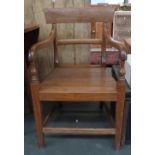 A vintage teak armchair 88cmH