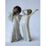 Two Lladro figurines, one of a girl stretching and yawning, marked NAO,
