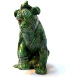 A Bretby green glazed figure of a wounded dog, possibly after Bruce Bairnsfather, circa 1920,
