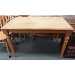 An oak kitchen table with turned legs 64 x113 x73cmH together with two pine kitchen chairs with