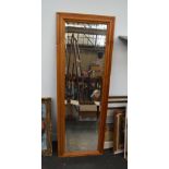 A pine dressing mirror with bevelled glass 135cmH x 48cm