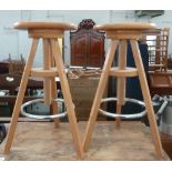 Two wooden adjustable bar stools