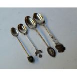 Four silver comemorative golf spoons