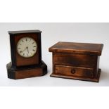A wooden carriage clock with roman numerals, movement by V.A.