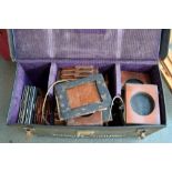 A large selection of photography plate holders in a carry case together with photogarphy negative