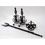 A mixed lot of wrought iron to include - two wall mounted brackets, a toasting fork,