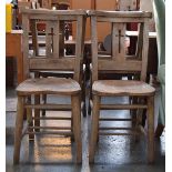 Four pine church chairs with pierced splats in the shape of crosses