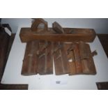 6 x moulding planes and 22" bench plane, all standard wood, no makers mark - mixed condition