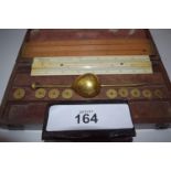 Sykes type hydrometer, weights slide rules, mahogany boxed with central oval label saying Patent