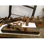 A wood framed saw, 3 assorted bench planes, 4 steel fermers and an old chisel (9 items)