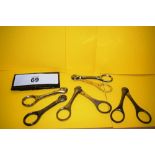 5 x assorted champagne wire cutters, 3 x steel stamped J N Not, bottle symbol 19th/20th Century, 1 x