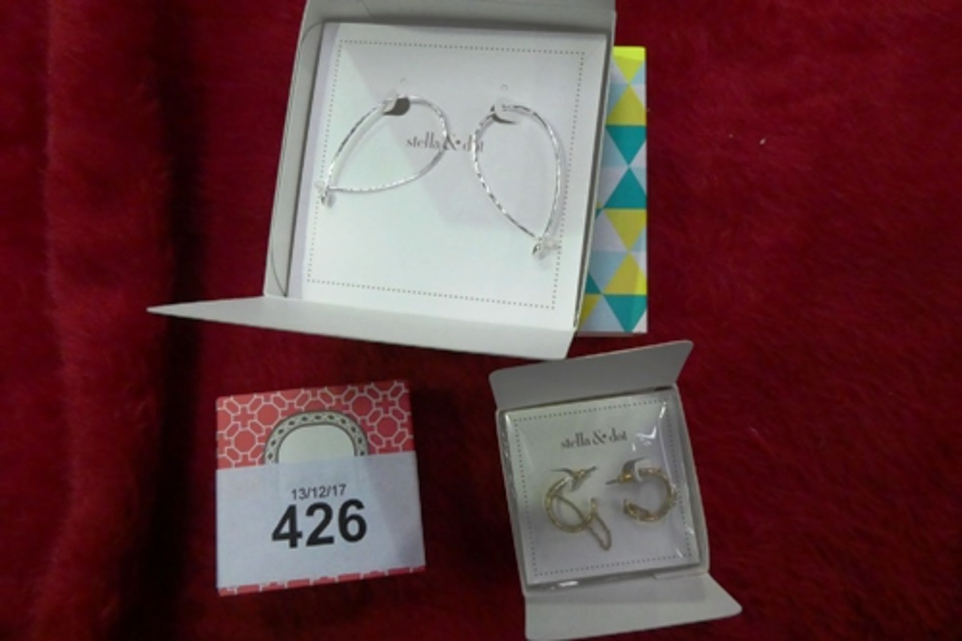 A pair of Stella and Dot hammered wire small silver hoops and a pair of Stella and Dot illusive gold