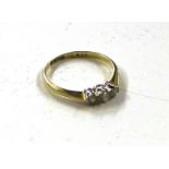 An 18ct gold three stone diamond set ring