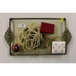 A dressing table tray with a quantity of costume j