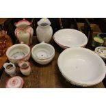 A quantity of wash jugs and bowls and chamber pots