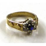 A 9ct gold diamond and sapphire set ring of flower