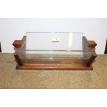 An Art Deco style wooden and glass book trough