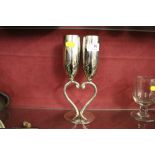 A pair of decorative plated champagne flutes