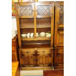 An oak and leaded glazed display cabinet with line