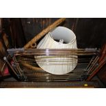 A loom corner linen basket containing a table lamp