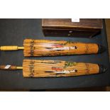 A pair of Japanese hand painted parasols