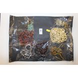 A quantity of costume jewellery to include simulat