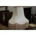 A mahogany table standard lamp and shade