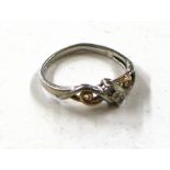 A silver and 10ct gold ring set with chip diamonds