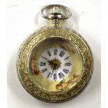 A gilt metal pocket watch with enamelled face