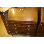 An 18th Century oak bureau fitted two short over t