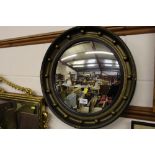 A gilt framed convex wall mirror