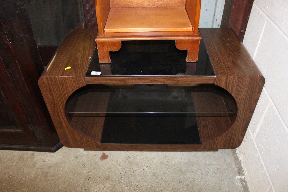 A black glass top television stand