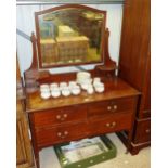 An Edwardian mahogany and inlaid dressing chest fi