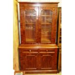 A Victorian mahogany and glazed bookcase raised on