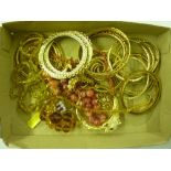 A tray of mostly bangles and bead necklaces etc.