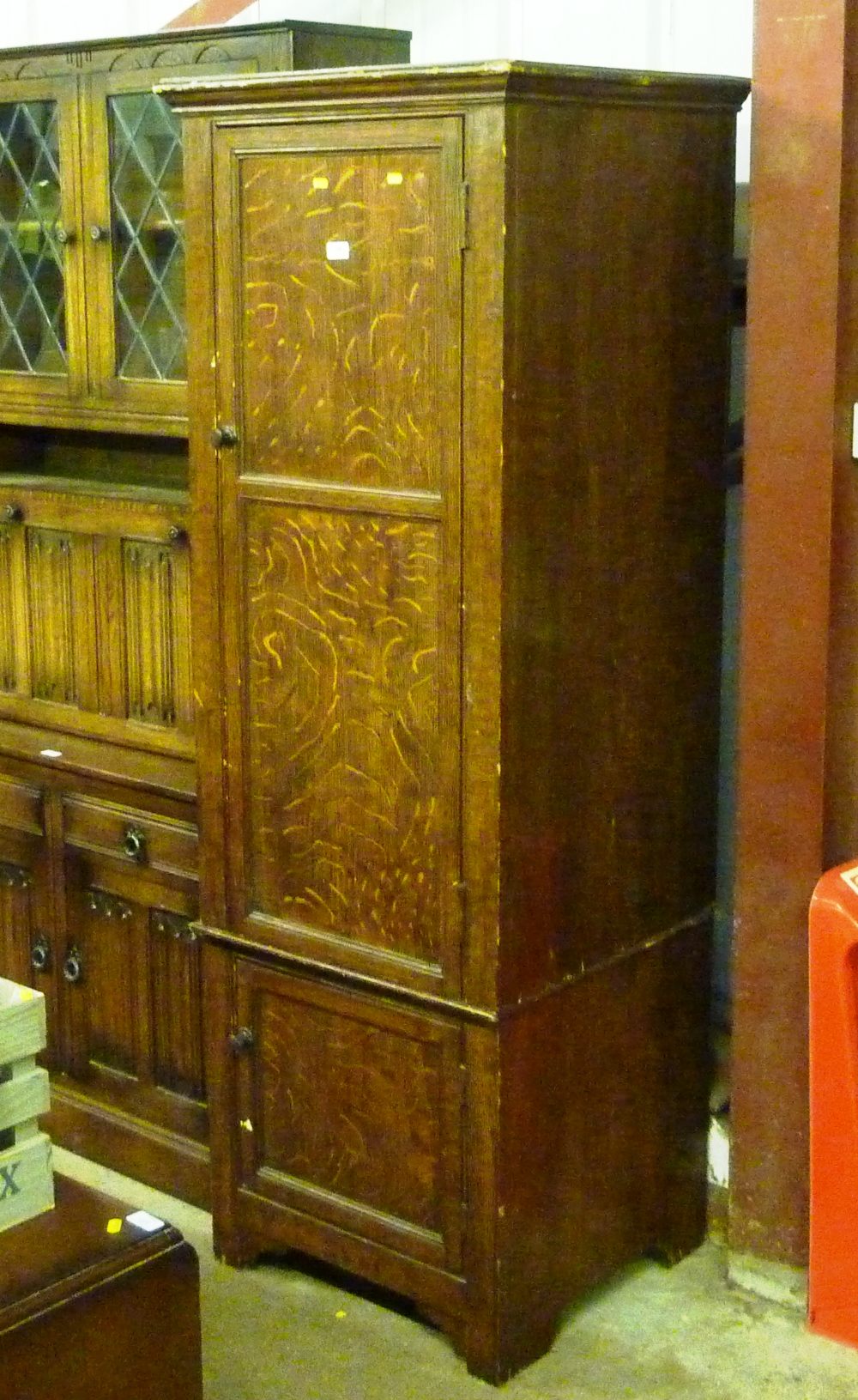 A Victorian grained pine cupboard