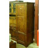 A Victorian grained pine cupboard