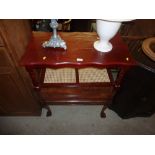 A two tier coffee table and a walnut coffee table