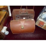 Three brown leather cases
